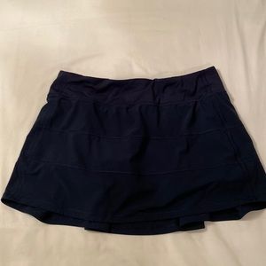 Navy Lululemon athletic skirt with built-in shorts, size 10